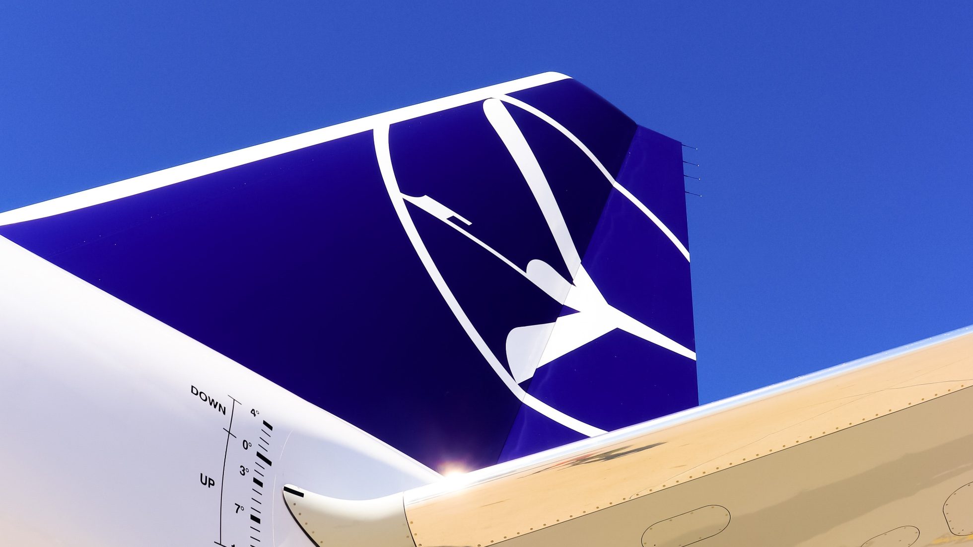 vertical stabilizer with LOT Crane logo on a sunny day